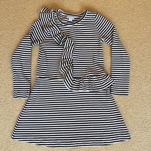 Adorable, navy & white striped dress, w ruffle sash over front and back. Size 6.